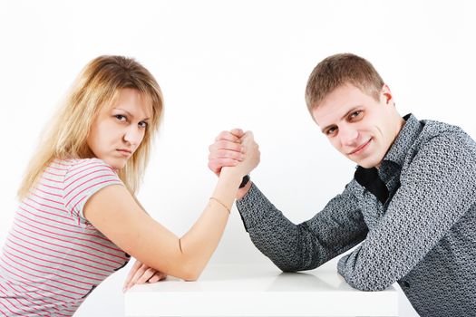 Woman struggling with a man. family armwrestling