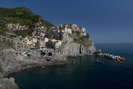 View of the picturesque village of Manarola in the heart of the Cinque Terre, important national park and world heritage of unesco