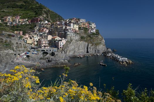 View of the picturesque village of Manarola in the heart of the Cinque Terre, important national park and world heritage of unesco