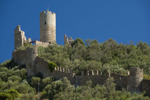 The castle on the hill over Noli, typical village of the ligurian riviera in Italy