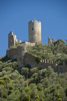 The castle on the hill over Noli, typical village of the ligurian riviera in Italy
