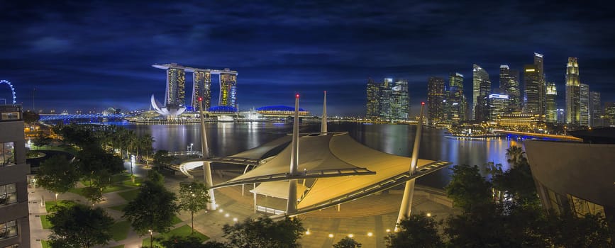 Singapore Central Business District CDB City Skyline at Blue Hour Evening by the Marina Esplanade Waterfront Panorama