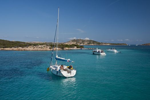 Boat sailing in the wonderful sea in Santa Maria , an island of the La Maddalena archipelago in Sardinia , Italy