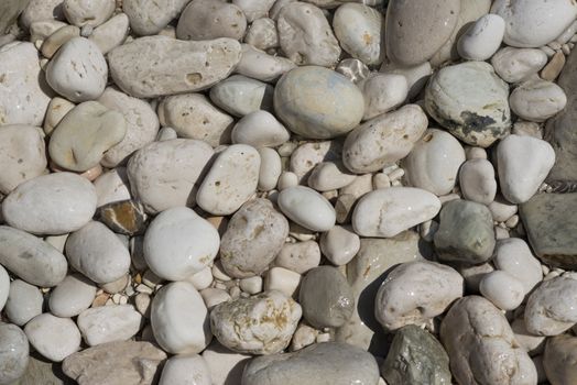 Smoothed pebbles on the beach in Italy