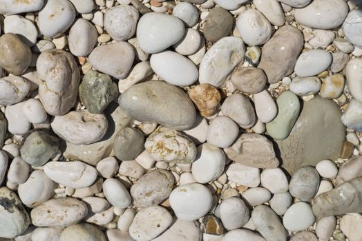 Smoothed pebbles on the beach in Italy