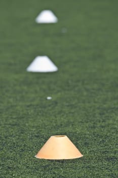 Yellow cone on a soccer field for training