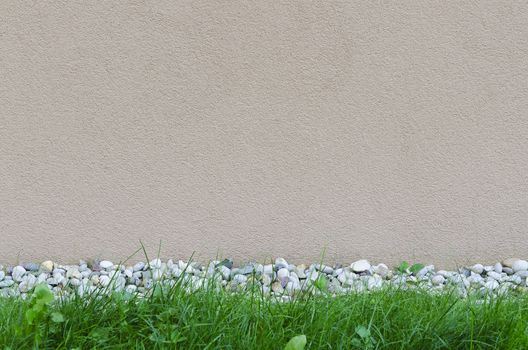 detail of a wall with rocks and grass decoration background