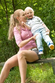 Happy mother and son having a nice day in the park