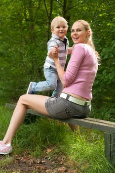 Happy mother and son having a nice day in the park