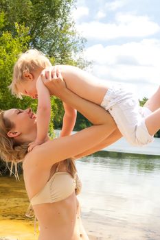 Happy mother and son having a nice day at the beach