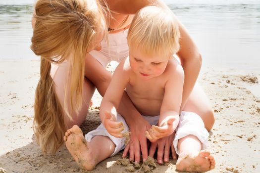 Happy mother and son having a nice day at the beach