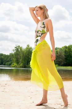 Beautifull model in bikini on the beach with sunny weather