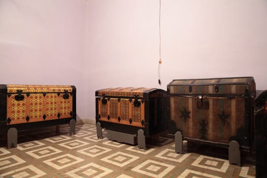 an old room with three trunks