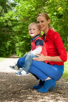 Happy mother and son having a nice day in the park