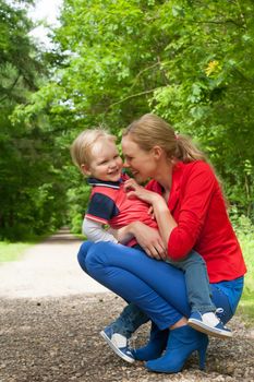 Happy mother and son having a nice day in the park