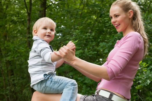 Happy mother and son having a nice day in the park