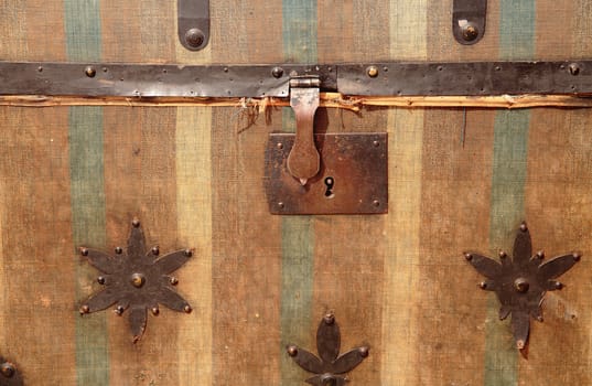 detail of the lock of an old and vintage trunk