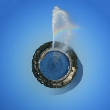 Planet with water fountain and rainbow on the lake by beautiful summer day, Geneva, Switzerland