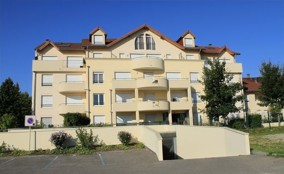New modern apartments in front of garage entrance