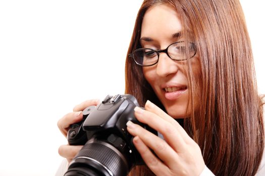A young hispanic woman checking the Images on a digital camera.