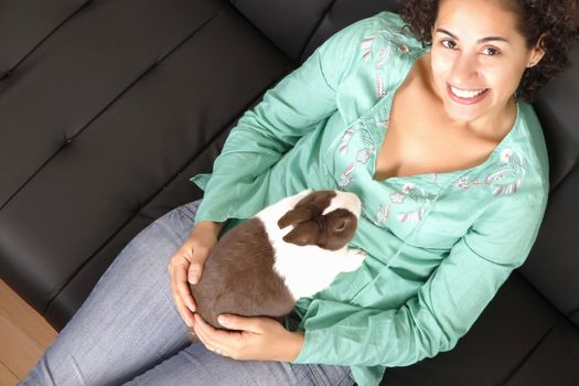 A young, brazilian woman with a Rabbit.
