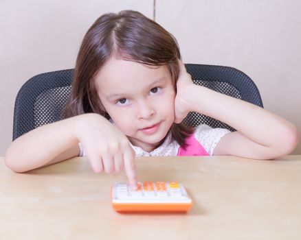 Asian child in office talking on telephone