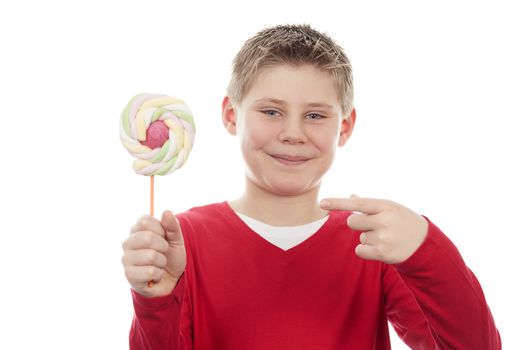 Portrait of beautiful joyful boy with big lollipop