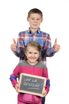 Happy children holding a slate on white background