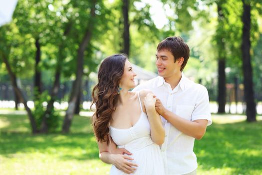 Portrait of a young romantic couple embracing each other