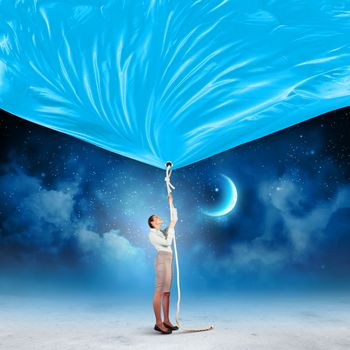 Image of businesswoman pulling banner with illustration. Day and night concept