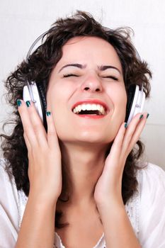 A young woman listening music with Headphones.