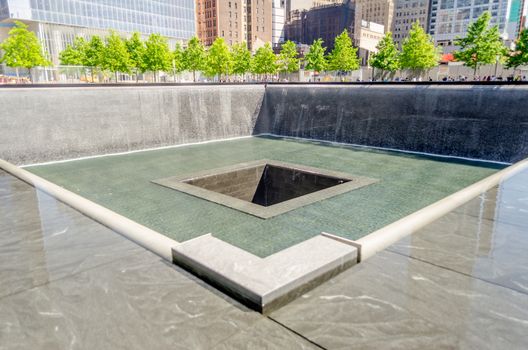 NEW YORK - MAY 27: NYC's 9/11 Memorial at World Trade Center Ground Zero seen on May 27, 2013. The memorial is located at the World Trade Center site, on the former location of the Twin Towers