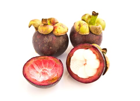 Isolate mangosteen on white background, the tropical purple fruit in Thailand.