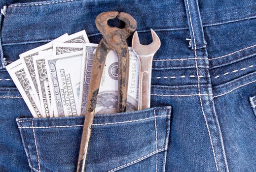 American dollar bills and tools in jeans pocket background