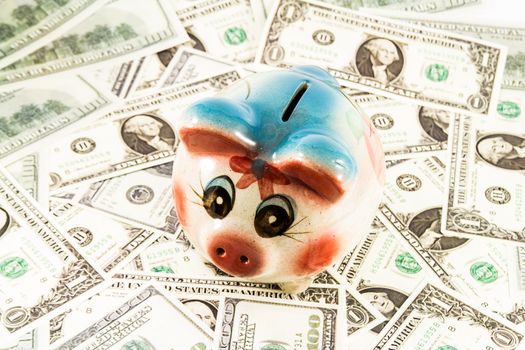 Piggy bank money box with on money background 