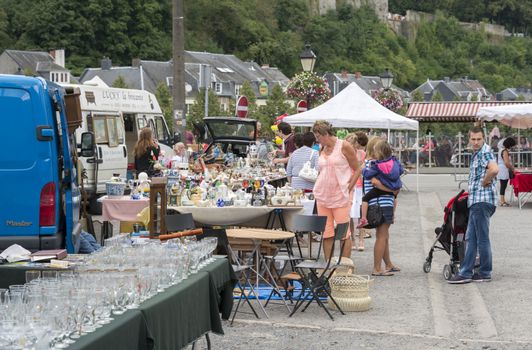 people shopping on the brocante market in the belgium place boullion
