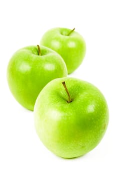 Three green apple on a white background