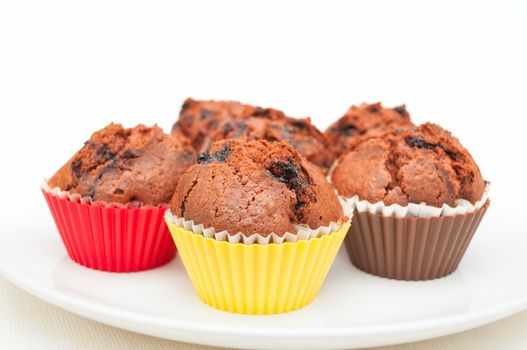 Chocolate Muffins With Blueberries On White Plate
