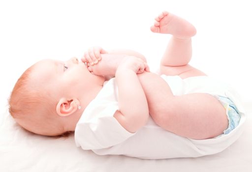 Cute Baby Girl Sucking Her Toes on White Background