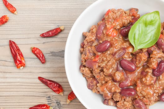 Top View of Chilli Con Carne in White Bowl and Red Chili Pepper