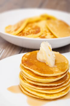 Homemade Pancakes With Butter and Warm Maple Syrup - Shallow Depth of Field