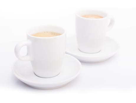 Two White Cups of Espresso Coffee on White Background - Shallow Depth of Field