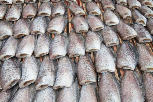 Dry Gourami fish, in a circle on bamboo plate