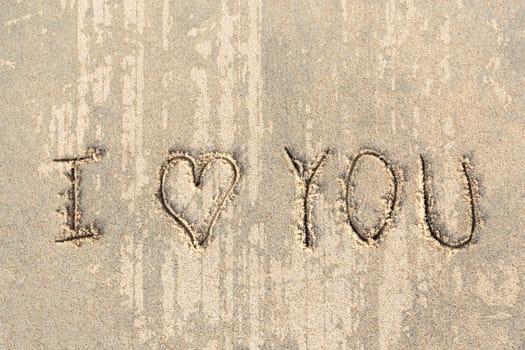 I love you handwritten in sand for natural, love,tourism or conceptual designs