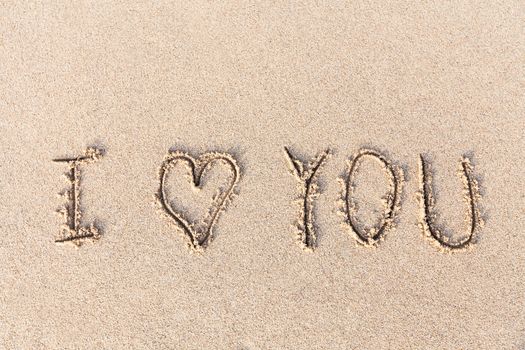 I love you handwritten in sand for natural, love,tourism or conceptual designs