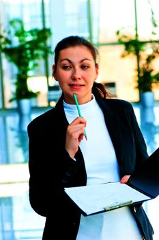 Young brunette woman in business suit pondered over the offer