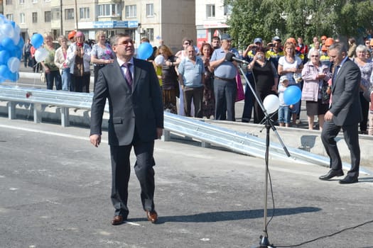 The governor of the Tyumen region Vladimir Yakushev at official opening of a new traffic intersection on Melnikayte St., Tyumen. 22.08.2013