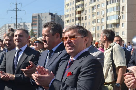 the mayor of Tyumen Alexander Moor, the governor of the Tyumen region Vladimir Yakushev and the director general of JSC Mostostroy-11 Nikolay Russu at opening of a new traffic intersection on Melnikayte St., Tyumen. 22.08.2013