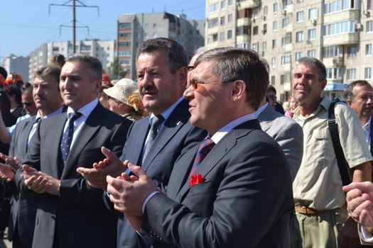 the mayor of Tyumen Alexander Moor, the governor of the Tyumen region Vladimir Yakushev and the director general of JSC Mostostroy-11 Nikolay Russu at opening of a new traffic intersection on Melnikayte St., Tyumen. 22.08.2013