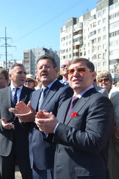 the mayor of Tyumen Alexander Moor, the governor of the Tyumen region Vladimir Yakushev and the director general of JSC Mostostroy-11 Nikolay Russu at opening of a new traffic intersection on Melnikayte St., Tyumen. 22.08.2013